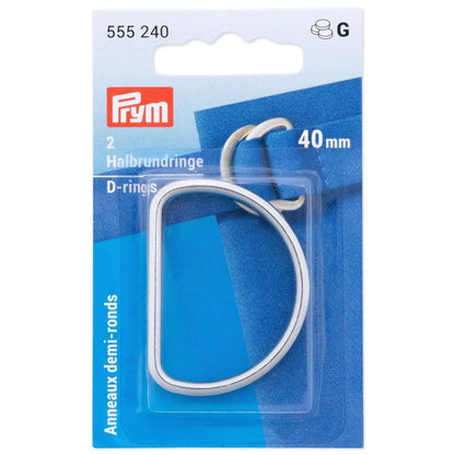 Zwei silberne Halbrundringe 40mm für Lederarbeiten, auf blauer Verpackung.