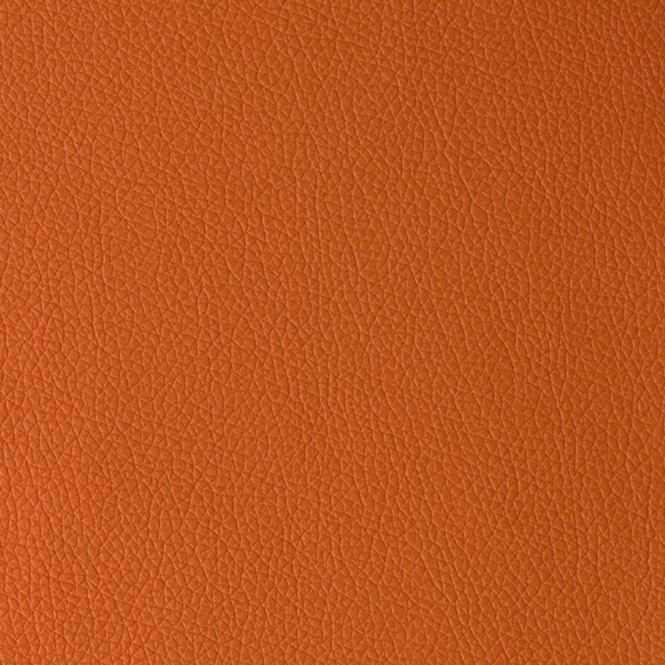 PVC-Kunstleder Phoenix in leuchtendem Orange, fein geprägte Oberfläche, strapazierfähig, wasserabweisend und ideal für lebendige Designakzente.